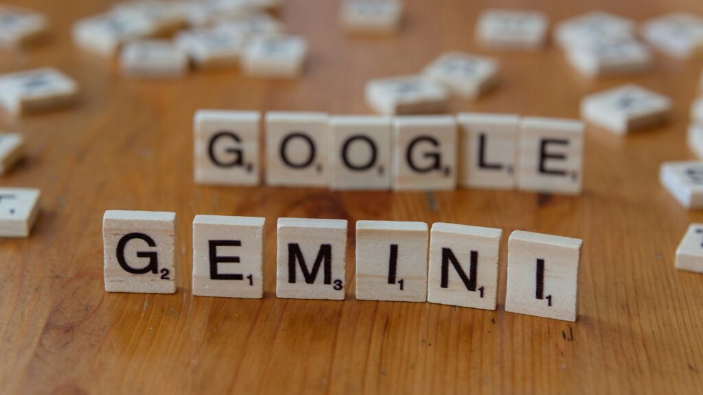 Scrabble letters spelling Gemini and Google